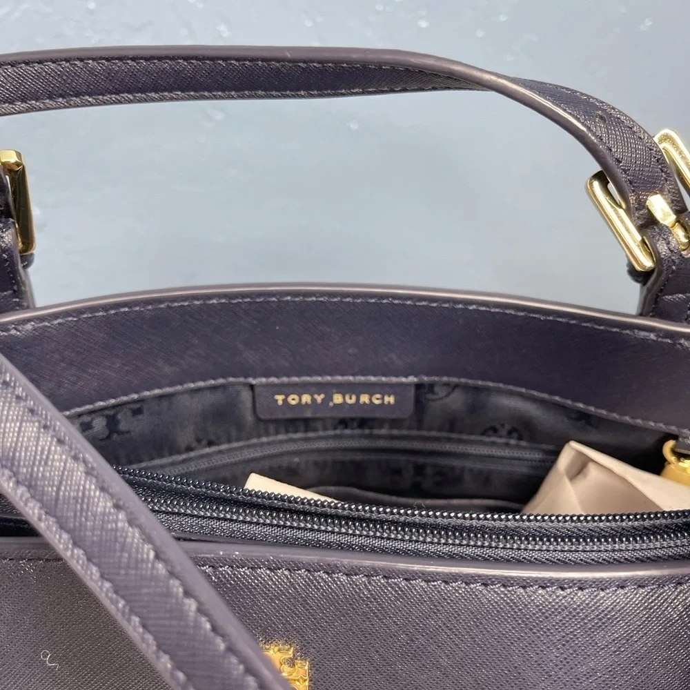 Tory Burch Saffiano leather medium Navy Blue top zip tote with material inside.